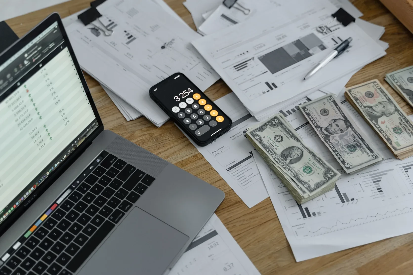 Accountant reconciling bank and accounting records on a laptop