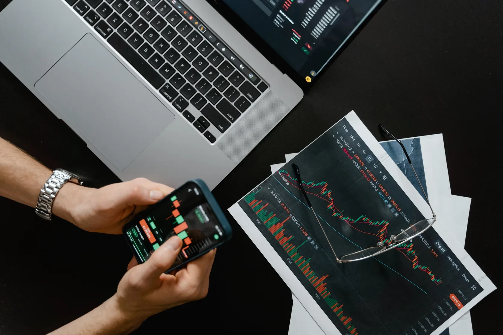 Professionals reviewing banking and finance dashboards at a desk